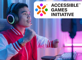 Accessible Games Initiative logo. Gamer playing at home with one short limb