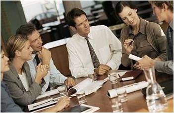 Business Man and Woman at a Meeting Room